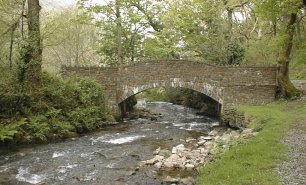 walking in england, stream and bridge near hunters inn on the somerset and Devon coast path in the Exmoor national park